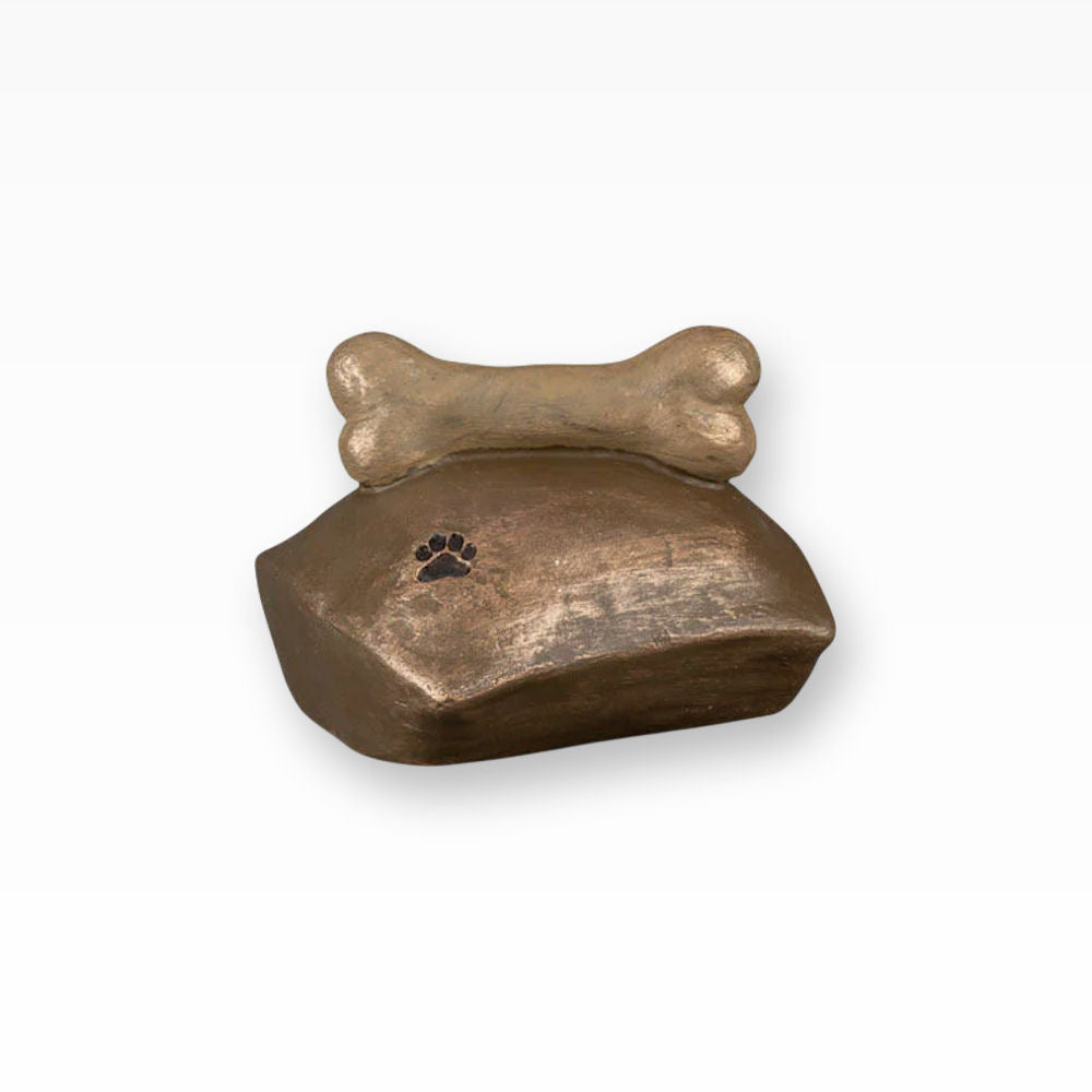 Hundeurne Knochen auf Kissen